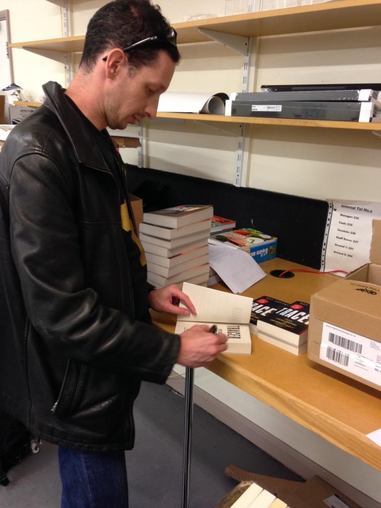 Rob Boffard signing copies of Tracer