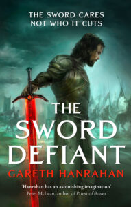 An image of the book cover of The Sword Defiant, which shows an ominous and moody illustration of an armoured man brandishing a glowing red sword